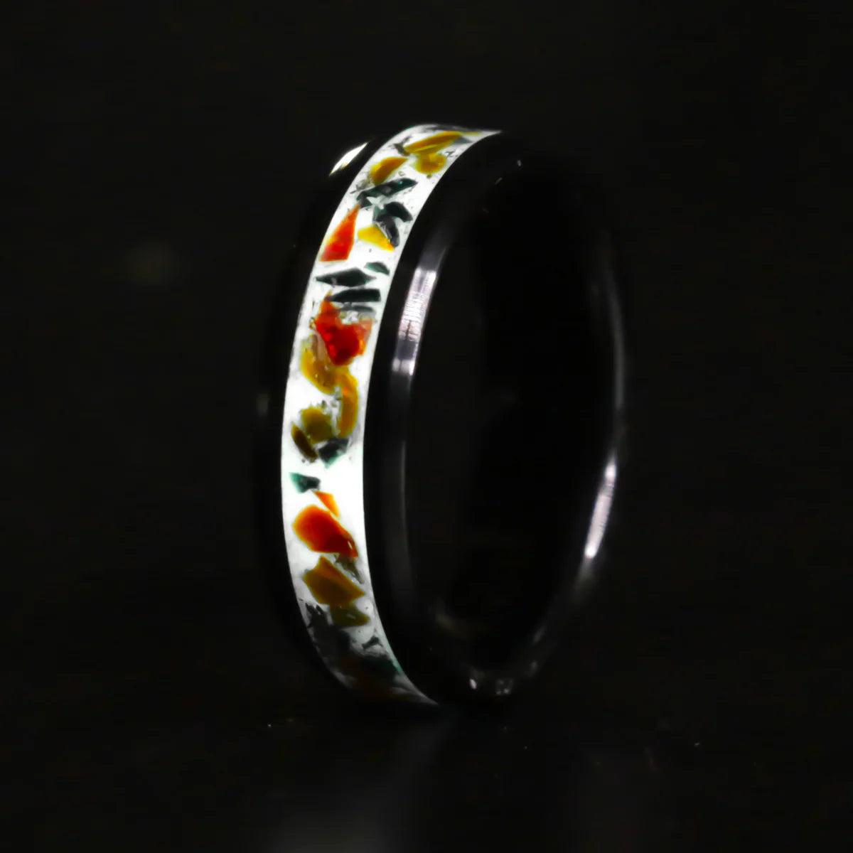 Ring with colorful floral pattern on a black background