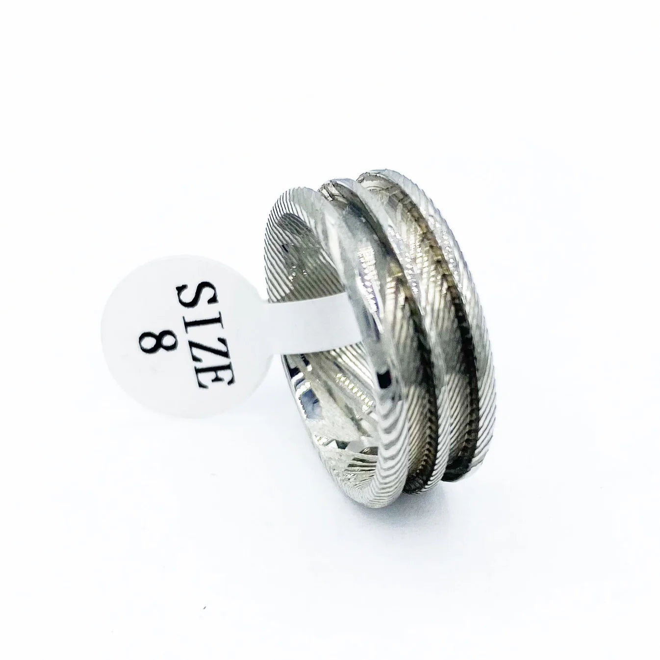 Damascus double channel ring for custom glow rings on a white background