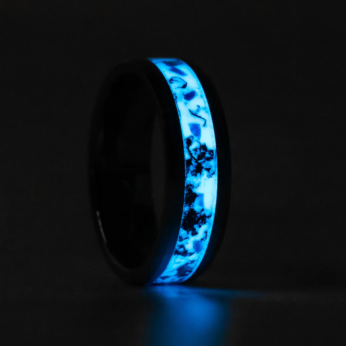 Custom order tungsten ring with copper and opal inlay glowing at night